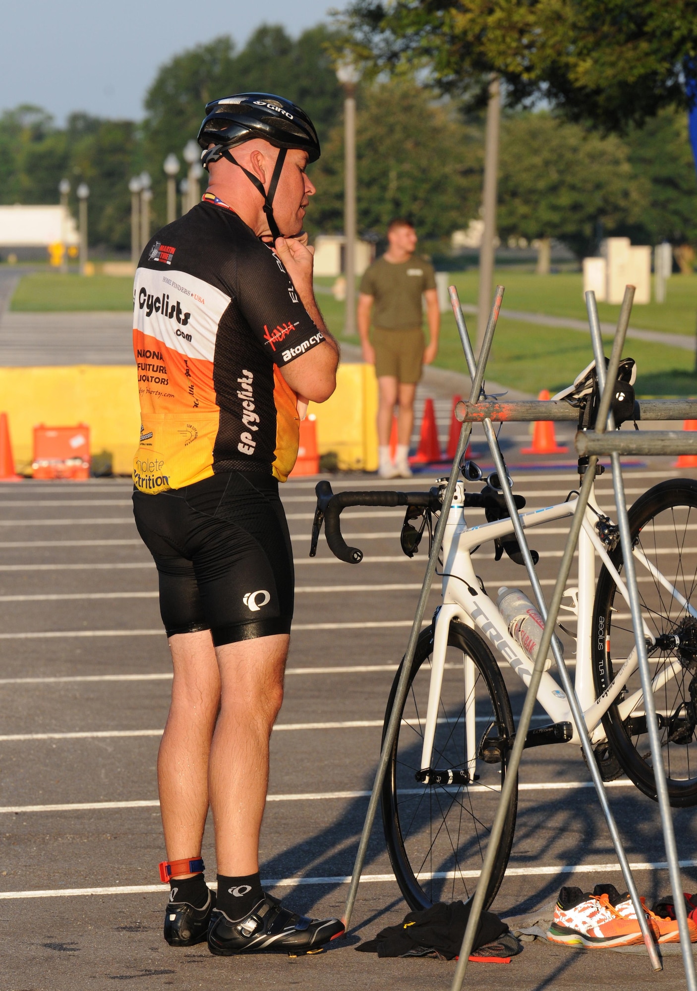 Staff Sgt. Bobby James, 336th Training Squadron student, fastens his bicycle helmet as he transitions from the swim event to the bike event during Keesler’s mini-triathlon Sept. 23, 2016, on Keesler Air Force Base, Miss. The event included a 200-yard swim, 9-mile bike ride and a 2-mile run.