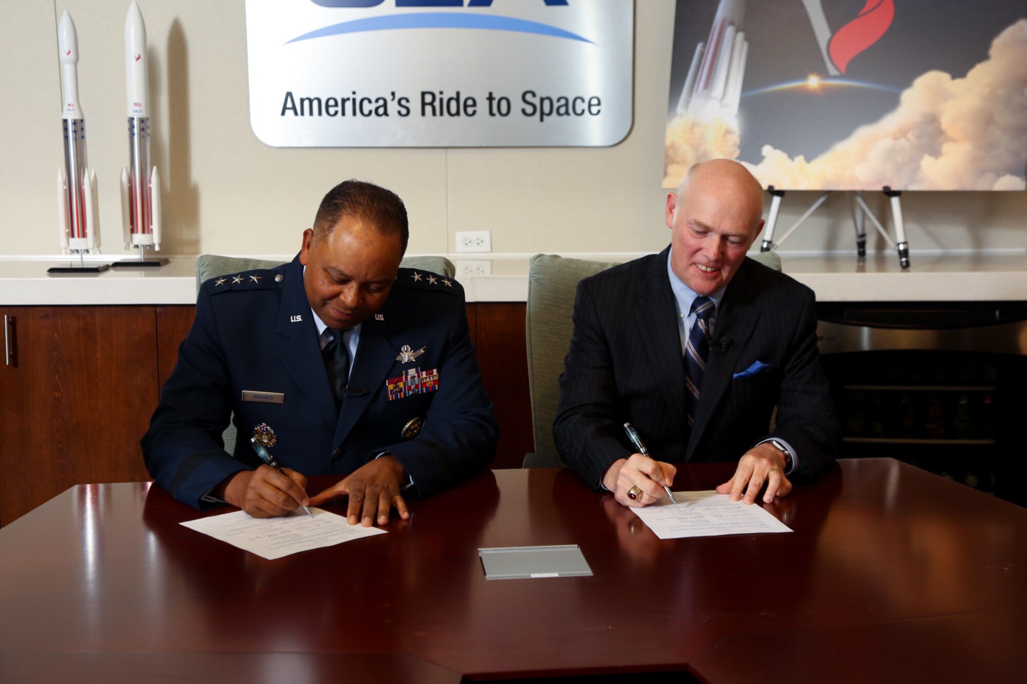 Lt. Gen. Samuel Greaves, Air Force program executive officer for Space and SMC commander, and Tory Bruno, ULA president and CEO, sign a Cooperative Research and Development Agreement or CRADA for the certification of ULA’s Vulcan Launch System at a ceremony, Sept. 27. (Photo Courtesy of ULA)