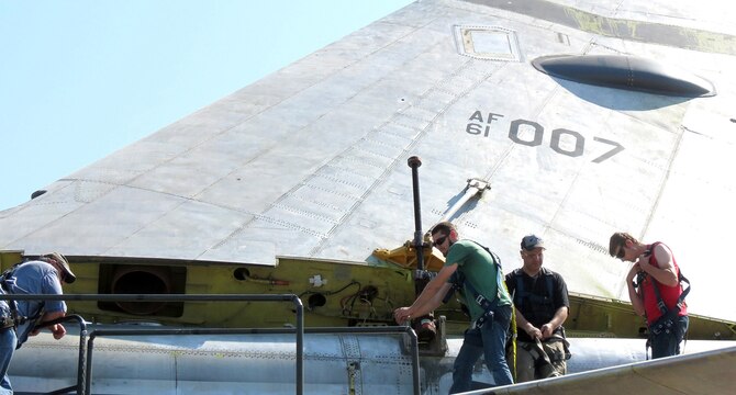 Members of the 565th Aircraft Maintenance Squadron reattach the tail on “Ghost Rider” July 31, 2016. The B-52H Stratofortress, tail number 61-007, recently underwent extensive programmed depot maintenance at Tinker Air Force Base. 'Ghost Rider' is the first B-52H to ever be regenerated from long-term storage with the 309th Aerospace Maintenance and Regeneration Group at Davis-Monthan AFB, Ariz., and returned to fully-operational flying status. (Air Force photo)                     