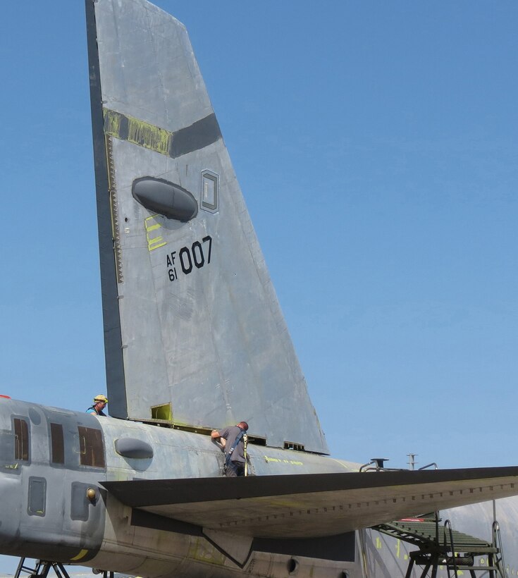 Members of the 565th Aircraft Maintenance Squadron reattach the tail on “Ghost Rider” July 31, 2016. The B-52H Stratofortress, tail number 61-007, recently underwent extensive programmed depot maintenance at Tinker Air Force Base. 'Ghost Rider' is the first B-52H to ever be regenerated from long-term storage with the 309th Aerospace Maintenance and Regeneration Group at Davis-Monthan AFB, Ariz., and returned to fully-operational flying status. (Air Force photo)               