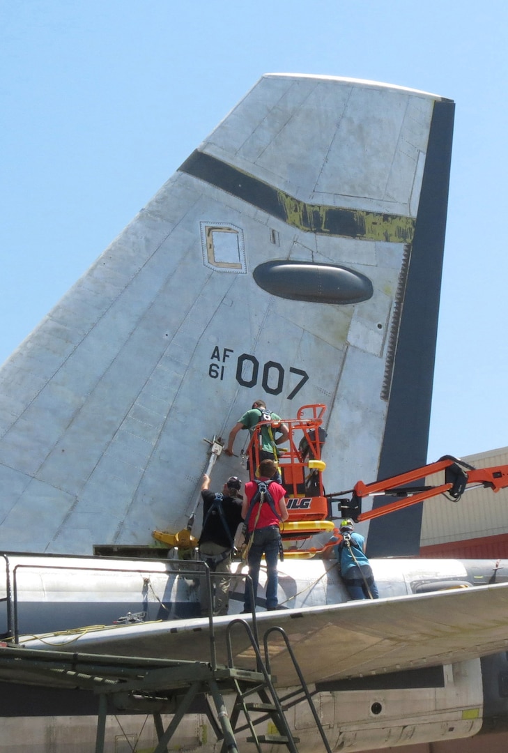 Members of the 565th Aircraft Maintenance Squadron reattach the tail on “Ghost Rider” July 31, 2016. The B-52H Stratofortress, tail number 61-007, recently underwent extensive programmed depot maintenance at Tinker Air Force Base. 'Ghost Rider' is the first B-52H to ever be regenerated from long-term storage with the 309th Aerospace Maintenance and Regeneration Group at Davis-Monthan AFB, Ariz., and returned to fully-operational flying status. (Air Force photo)                