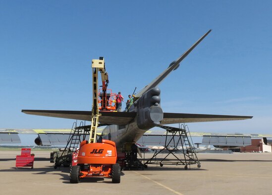 Members of the 565th Aircraft Maintenance Squadron reattach the tail on “Ghost Rider” July 31, 2016. The B-52H Stratofortress, tail number 61-007, recently underwent extensive programmed depot maintenance at Tinker Air Force Base. 'Ghost Rider' is the first B-52H to ever be regenerated from long-term storage with the 309th Aerospace Maintenance and Regeneration Group at Davis-Monthan AFB, Ariz., and returned to fully-operational flying status. (Air Force photo)                  