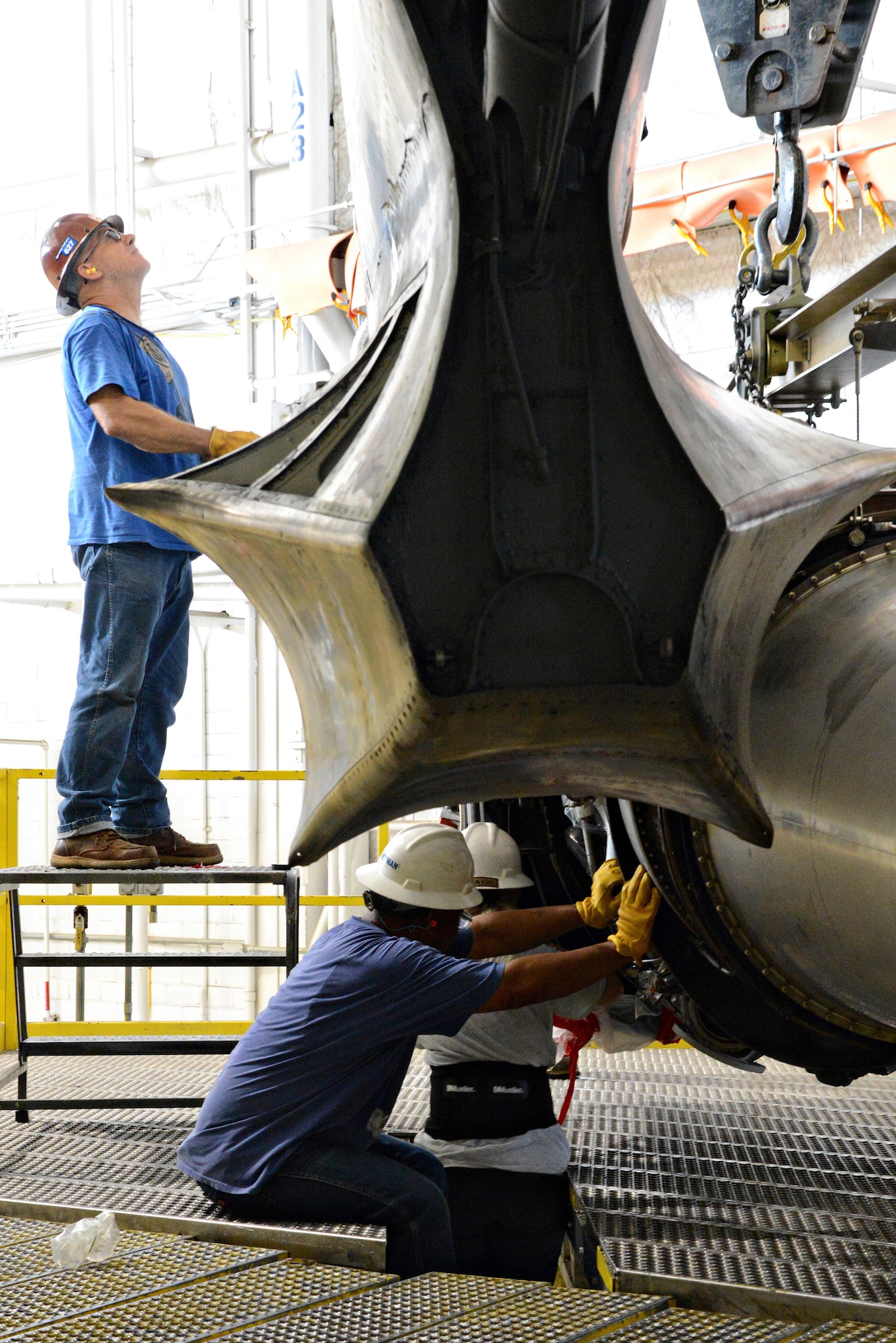 Members of the 565th Aircraft Maintenance Squadron install one of eight engines on “Ghost Rider” July 8, 2016. The B-52H Stratofortress, tail number 61-007, recently underwent extensive programmed depot maintenance at Tinker Air Force Base. 'Ghost Rider' is the first B-52H to ever be regenerated from long-term storage with the 309th Aerospace Maintenance and Regeneration Group at Davis-Monthan AFB, Ariz., and returned to fully-operational flying status. (Air Force photo by Kelly White)