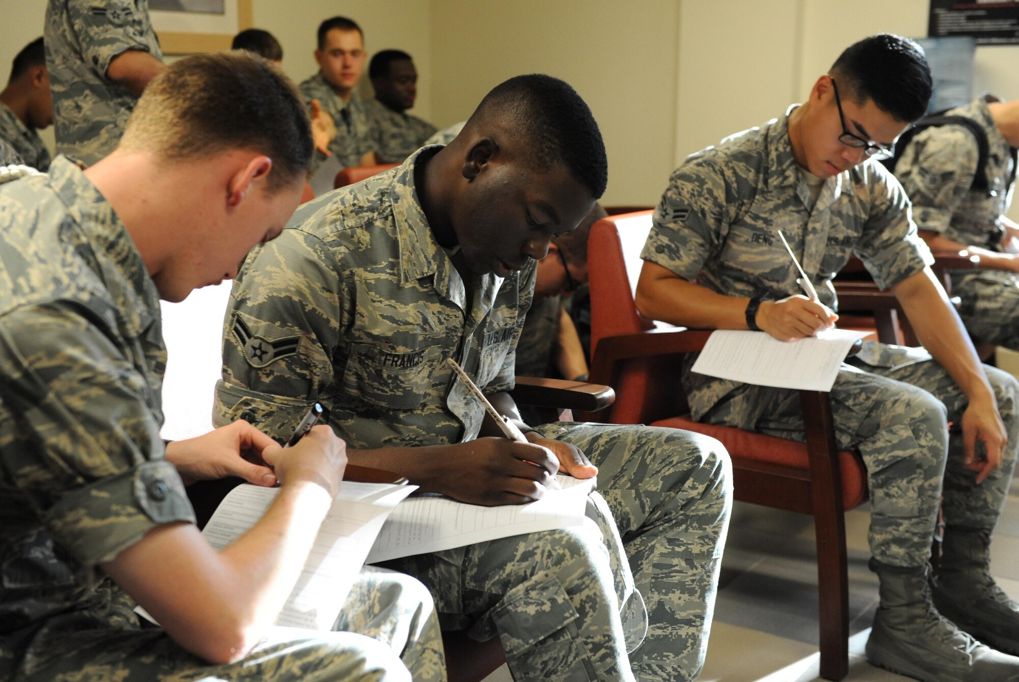 Airmen ‘patients’ complete patient forms at the Triangle Clinic during a public health emergency exercise Sept. 21, 2016, on Keesler Air Force Base, Miss. The weeklong exercise tested how the 81st Medical Group responds during a mass sickness outbreak. The 81st MDG staged a point of dispensing to diagnose, discuss treatment plans and provide medicine to sick Airmen.