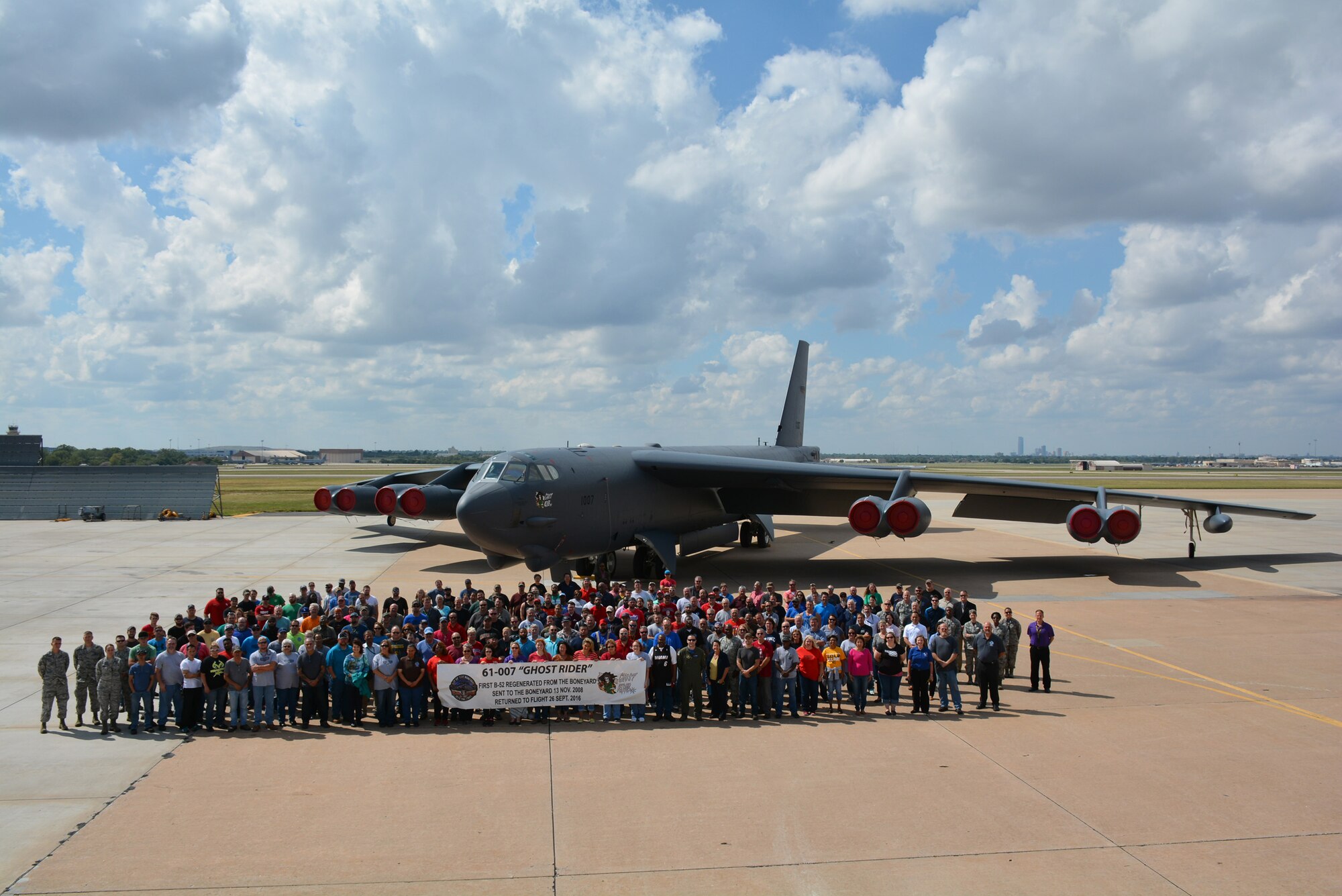 The Ghost Rider Enterprise Team pose Sept. 23, 2016, in front of the historic B-52H Stratofortress that was taken from the National Level Reservoir of Air and Space Capability, the world’s largest airplane storage facility, run by the 309th Aerospace Maintenance and Regeneration Group near Tucson, Ariz. Ghost Rider spent the last 9 months undergoing extensive programmed depot maintenance at the Oklahoma City Air Logistics Complex before going back into the fight. The team is made up of members of the OC-ALC, 76th Aircraft Maintenance Group, 76th Propulsion Maintenance Group, 76th Commodities Maintenance Group, 848th Supply Chain Management Group, Air Force Life Cycle Management Center, 10th Flight Test Squadron and Defense Logistics Agency. (Air Force photo by Darren D. Heusel)