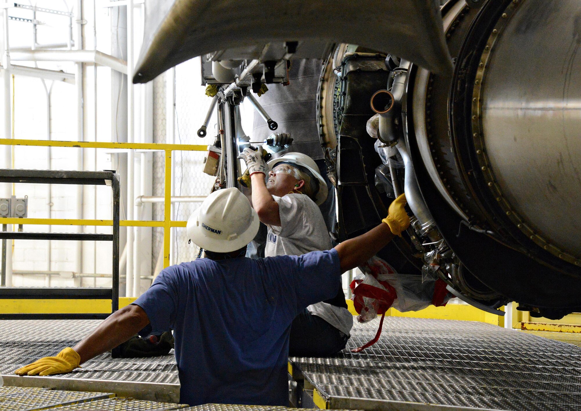 Members of the 565th Aircraft Maintenance Squadron install one of eight engines on “Ghost Rider” July 8, 2016. The B-52 Stratofortress, tail number 61-007, recently underwent extensive programmed depot maintenance at Tinker Air Force Base. 'Ghost Rider' is the first B-52H to ever be regenerated from long-term storage with the 309th Aerospace Maintenance and Regeneration Group at Davis-Monthan AFB, Ariz., and returned to fully-operational flying status. (Air Force photo by Kelly White)