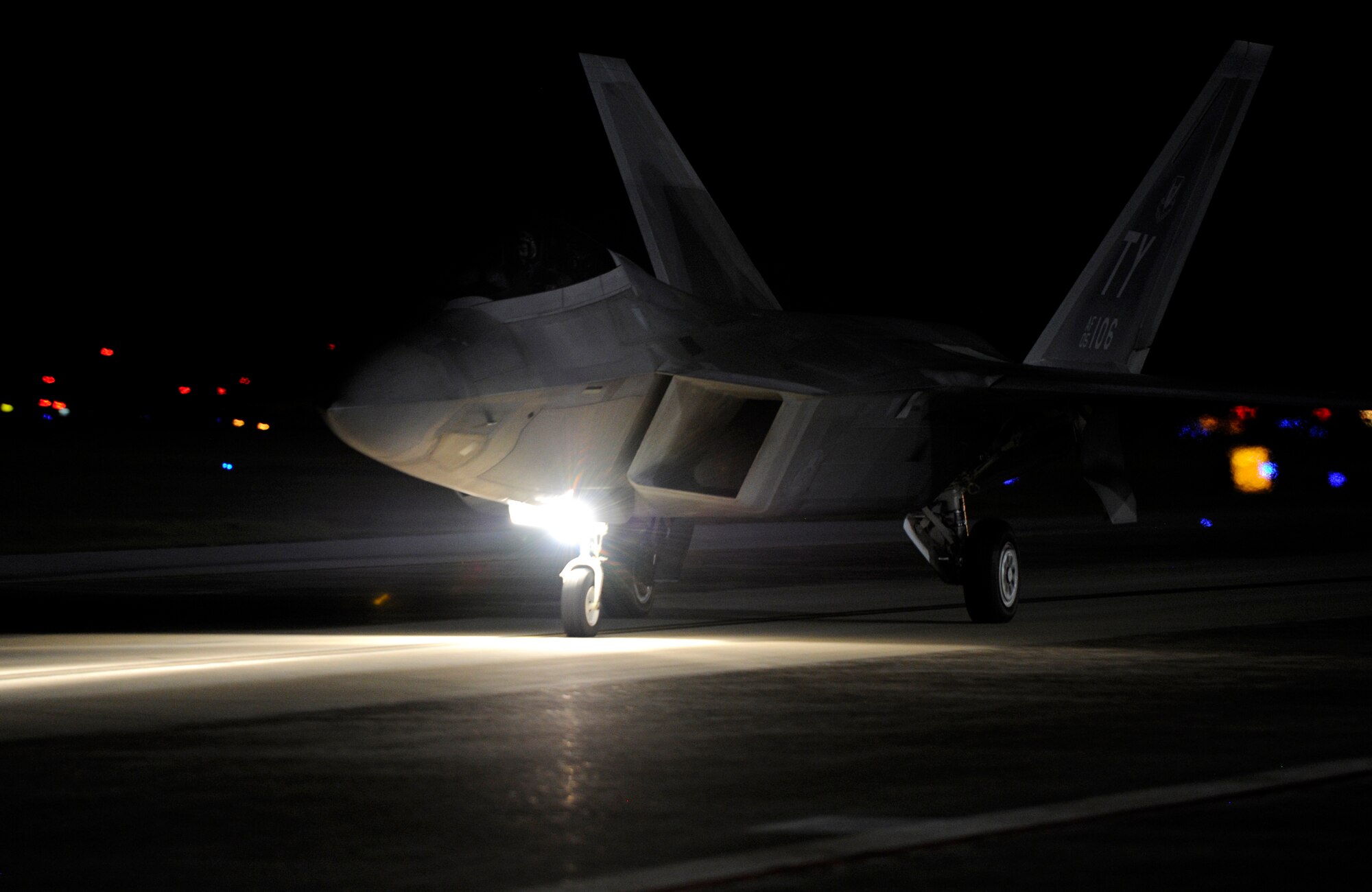 An F-22 Raptor taxis down the Tyndall flightline prior to supporting a night flying mission Sept. 21, 2016. To ensure pilot, maintainer and tower personnel readiness, Tyndall Airman train at night periodically throughout the year. (U.S. Air Force photo by Senior Airman Solomon Cook/Released) 