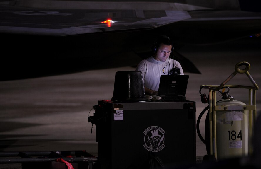 U.S. Air Force Senior Airman Samuel Strickland, 325th Aircraft Maintenance Squadron tactical aircraft maintenance technician, runs diagnostics on an F-22 Raptor on the Tyndall Air Force Base flightline, Sept. 21, 2016. The 325th Aircraft Maintenance Squadron trains and provides F-22 Raptor maintenance professionals for worldwide assignment, directing maintenance activities for the largest aircraft maintenance squadron in the Combat Air Force. (U.S. Air Force photo by Senior Airman Solomon Cook/Released)