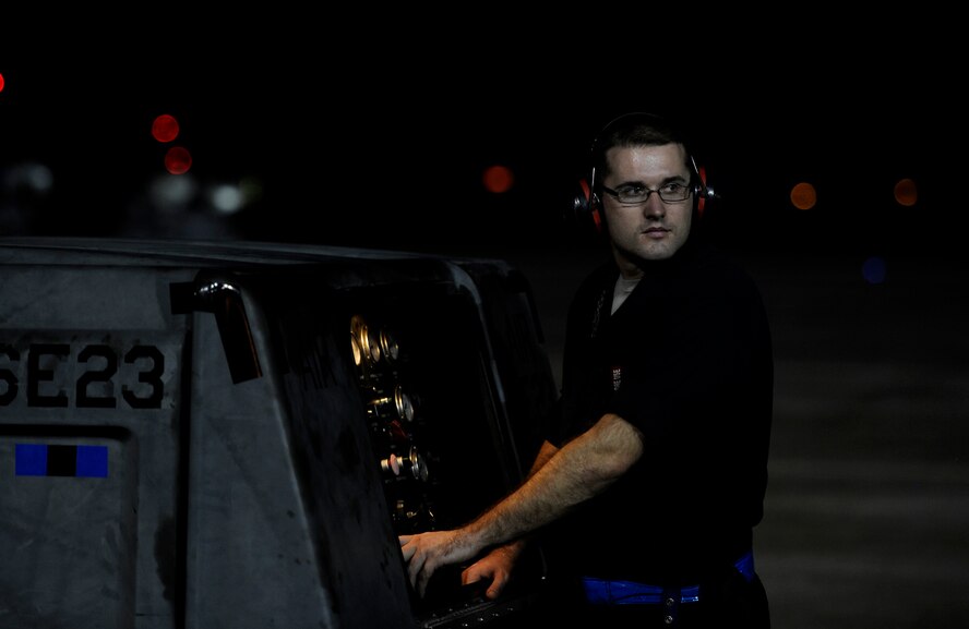 U.S. Air Force Senior Airman Steven Brinely, 325th Aircraft Maintenance Squadron tactical aircraft maintenance technician, prepares the stored energy system servicing cart before an F-22 Raptor engine is started for a night flying operation Sept. 21, 2016. The SES is used to start the auxiliary power unit. The APU must started before the F-22’s engine can ignite. (U.S. Air Force photo by Senior Airman Solomon Cook/Released) 