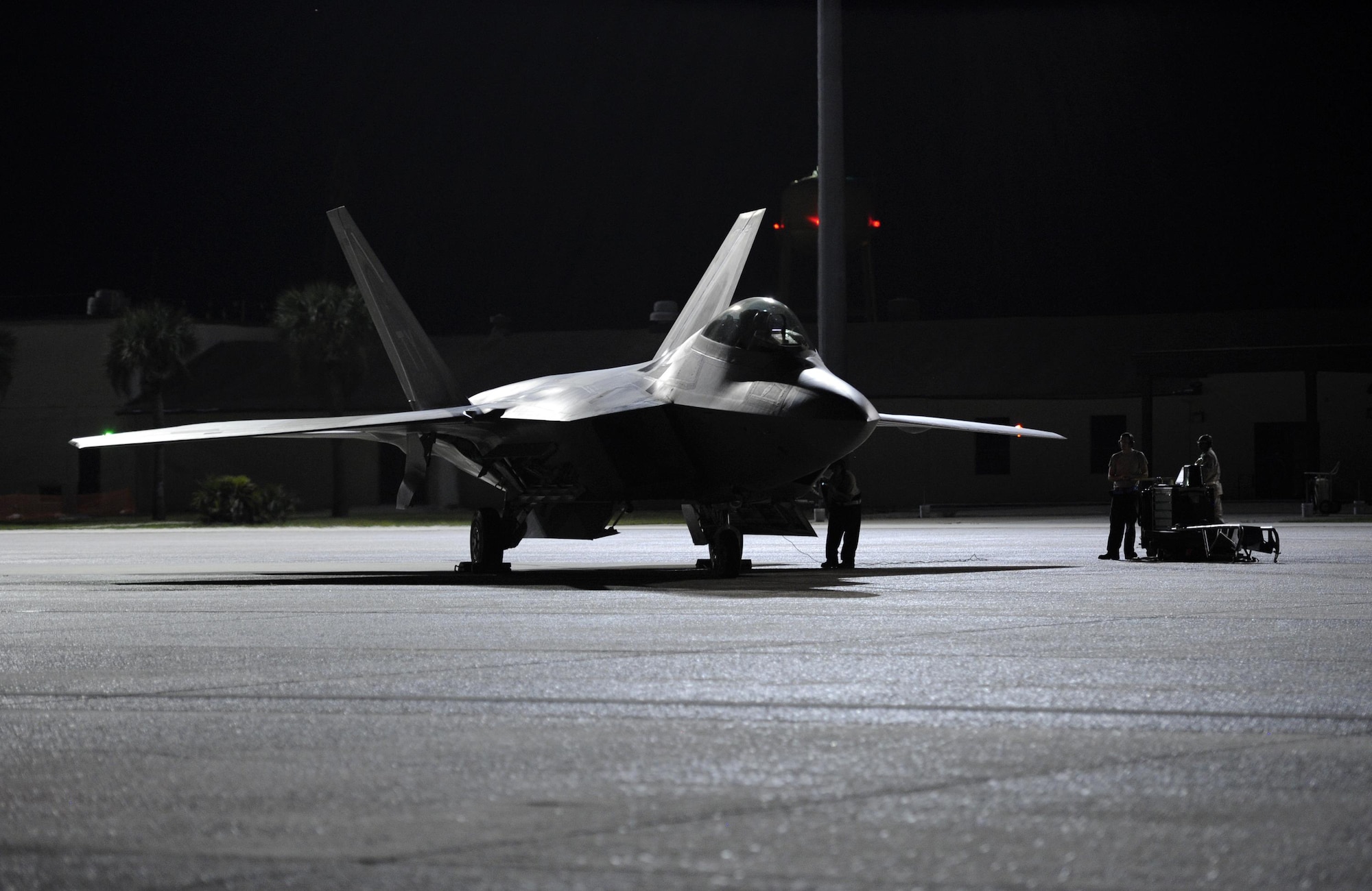An F-22 Raptor runs final diagnostics prior to taxiing down the Tyndall flightline to supporting a night flying mission Sept. 21, 2016. Tyndall and its units fly night operations several times throughout the year to ensure Airmen’s readiness to project combat airpower. (U.S. Air Force photo by Senior Airman Solomon Cook/Released) 