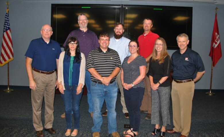 Among the first class members selected for the Engineer Research and Development Center University are, front row (l to r), Dr. Jeffery Holland, ERDC director, Erica Medley, Huntington District; Cody Eckhardt, Mississippi Valley Division; Cynthia Fowler, San Francisco District; Elizabeth Godsey, Mobile District; Dr. David Pittman, ERDC deputy director. Back row (l to r): Stephen Brown, Albuquerque District; Casey Ehorn, Nashville District; and Richard Allen, Mobile District. Not pictured, Travis Barnett, Jacksonville District, who will be at the Geospatial Research Laboratory site. 