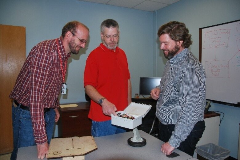 The Engineer Research and Development Center's Coastal and Hydraulics Laboratory Researchers Mike Follum, left, and Ian Floyd, right, are working with  Albuquerque District's Hydrologic Engineer Stephen Brown, center, on a six-month project creating a Gridded Surface Subsurface Hydrologic Analysis simulation for the Las Conchas wildfire region in Northern New Mexico, with
widespread future application opportunities. Brown was selected as one of eight participants in the ERDC University pilot program. 
