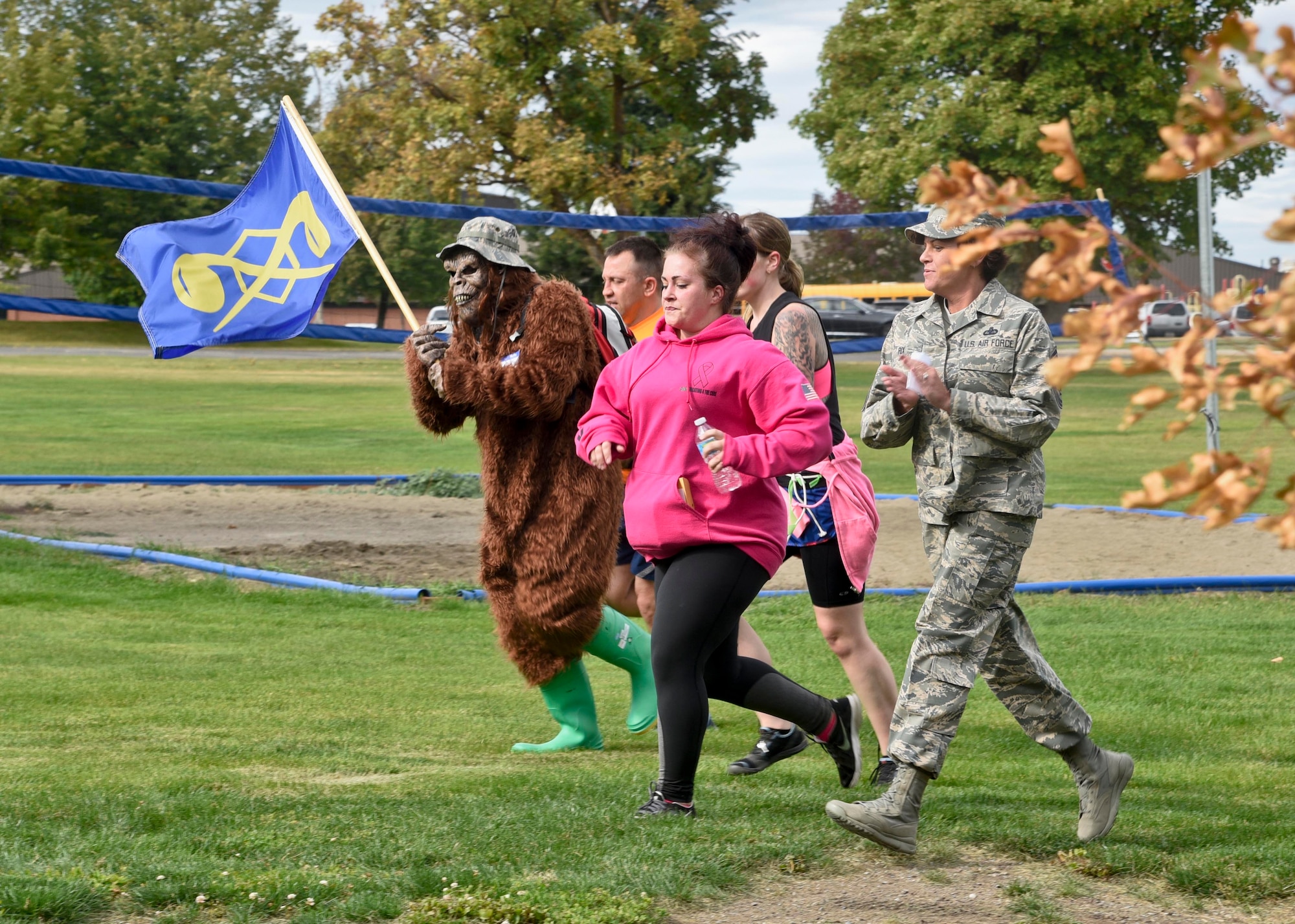 Chief Master Sgt. Shannon Rix, 92nd Air Refueling Wing command chief, runs with Staff Sgt. Amberlyn Laboy, 92nd Communications Squadron cyber systems operator, during the last part of the Amazing Zombie Race Sept. 22, 2016, at Fairchild Air Force Base. Four-person teams competed against each other to complete basic preparedness and survival challenges, while also running from “zombies”. (U.S. Air Force photo/Airman 1st Class Taylor Shelton)