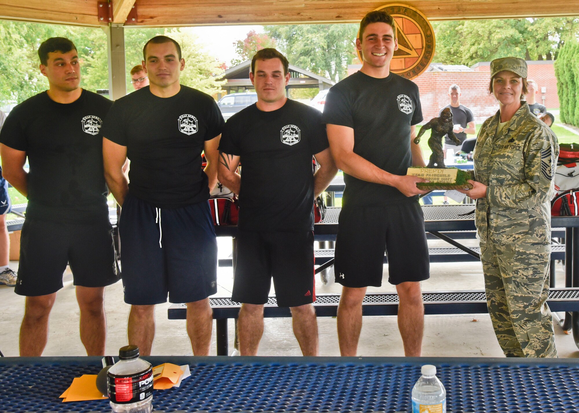 Airmen from the 22nd Training Squadron receive the Team Fairchild Outstanding Unit Readiness Trophy from Chief Master Sgt. Shannon Rix, 92nd Air Refueling Wing command chief, for winning the Amazing Zombie Race Sept. 22, 2016, at Fairchild Air Force Base. The event was put together by the Emergency Management office and will continue to be held every year for National Preparedness Month. (U.S. Air Force photo/Airman 1st Class Taylor Shelton)