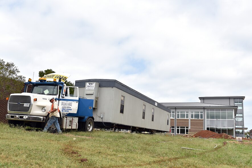 A driver prepares the construction site office trailer for removal Sept. 27, 2016, in the central campus area outside the new facility at the I.G. Brown Training and Educaiton Center in Louisville, Tenn. Site managers are operating from the lower floor of the new classroom building until project completion. (U.S. Air National Guard photo by Master Sgt. Mike R. Smith)
