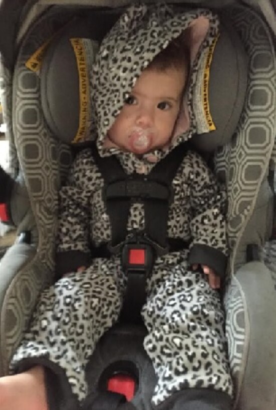 Eight-month-old sits correctly and comfortably in a rear-facing infant bucket car seat. (U.S. Air Force photo/ TSgt. Amelia Leonard)