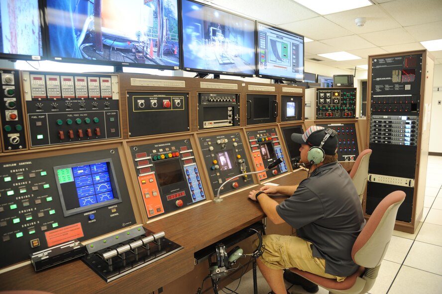 Control room monitors are observed by Jacob Wiggins, 96 TG/OL-AC Test Technician, while tests are being performed at the 96th Test Group Aerospace Survivability and Safety Office at Wright-Patterson AFB. (U.S. Air Force photo/Sandy Simison)