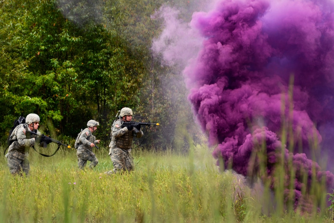 Soldiers advance under the cover of smoke to assault an objective during training at McCrady Training Center in Eastover, S.C., Sept. 20, 2016. Army National Guard photo by 1st Lt. Jessica Donnelly