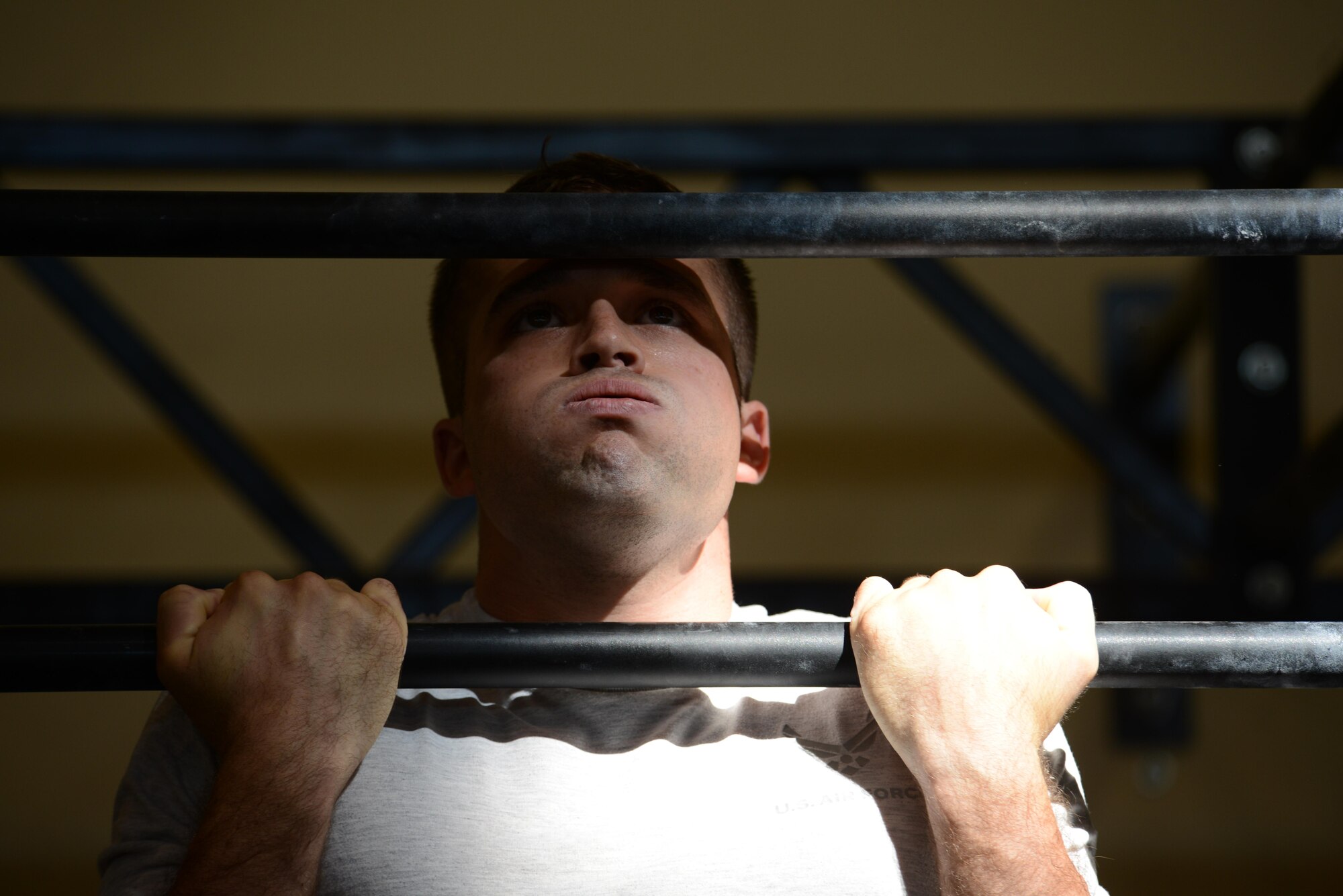 Senior Airman Andrew Trueman, 31st Security Forces Squadron security controller, completes a flexed arm hang test during the German Armed Forces Proficiency Badge competition at Aviano Air Base, Italy on Sept. 19, 2016. The competition included several timed events where Airmen competed for gold, silver or bronze badges. (U.S. Air Force photo by Staff Sgt. Andrew M. Satran/Released)