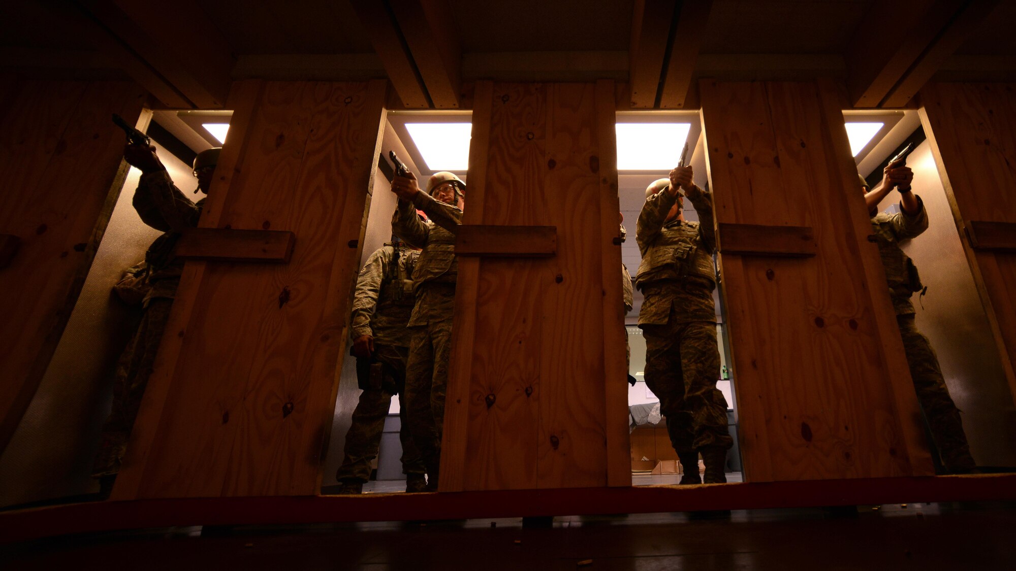 Team Aviano Airmen practice handling an M9 pistol before a marksmanship test during the German Armed Forces Proficiency Badge competition at Aviano Air Base, Italy on Sept. 19, 2016. The purpose of the badge is to recognize military members who are physically and mentally fit. (U.S. Air Force photo by Staff Sgt. Andrew M. Satran/Released)