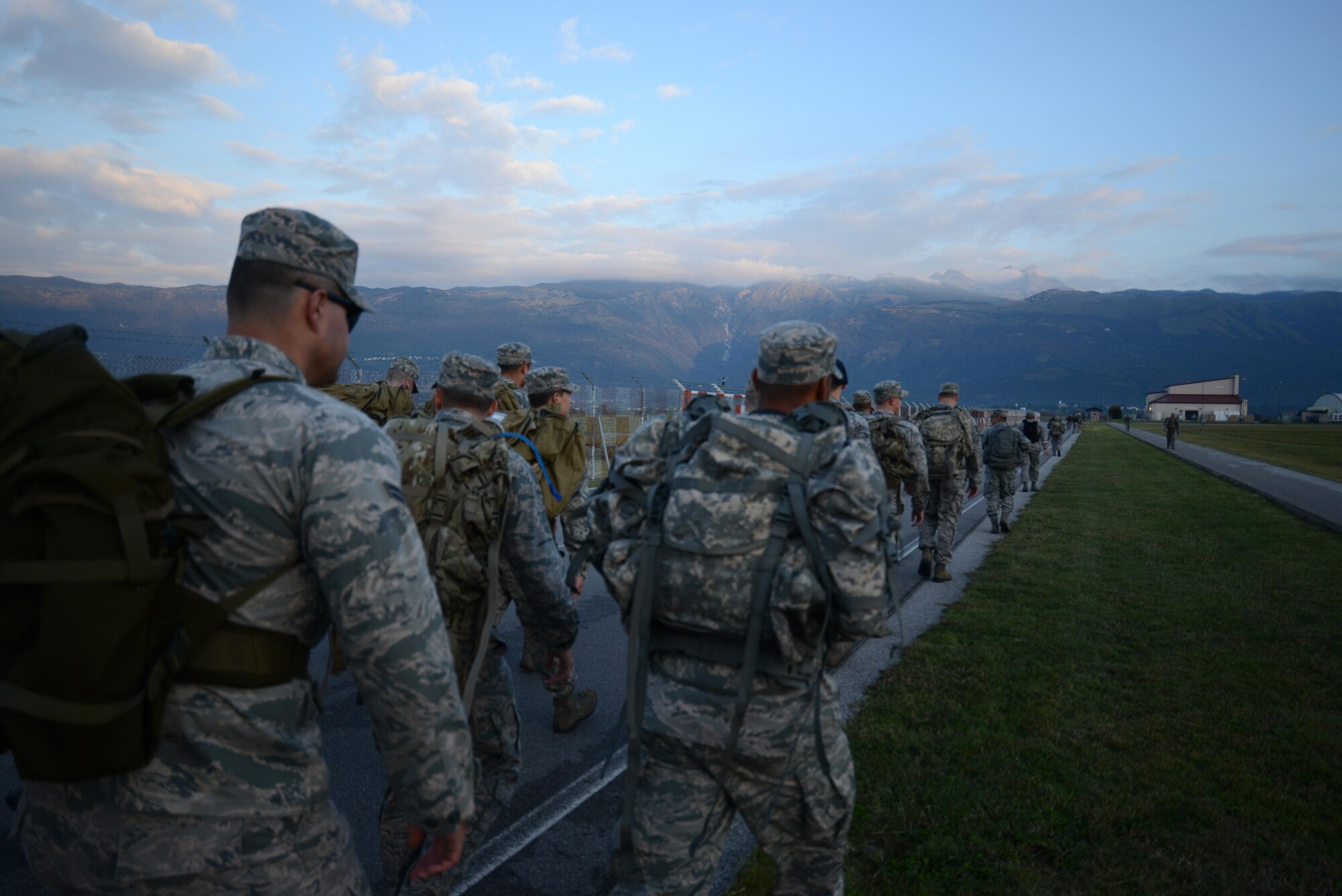 Airmen compete in a road march during the German Armed Forces Proficiency Badge competition at Aviano Air Base, Italy on Sept. 19, 2016. This was the last of six tests to finish the competition. (U.S. Air Force photo by Staff Sgt. Andrew M. Satran/Released)