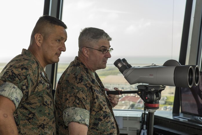 U.S. Marine Corps Sgt. Maj. Mario A. Marquez, left, 1st Marine Aircraft Wing (MAW) sergeant major, and U.S. Marine Corps Sgt. Maj. Lee D. Bonar Jr., III Marine Expeditionary Force (MEF) sergeant major, observe Marine Corps Air Station Iwakuni during a command visit at MCAS Iwakuni, Japan, Sept. 27, 2016. The command visit entailed a meeting with the senior enlisted leaders of the air station, staff noncommissioned officer professional military education, breakfast with noncommissioned officers and afforded the senior enlisted leaders of III MEF, Marine Corps Installations Pacific and 1st MAW the opportunity to view the transformation of the air station. (U.S. Marine Corps photo by Lance Cpl. Aaron Henson)