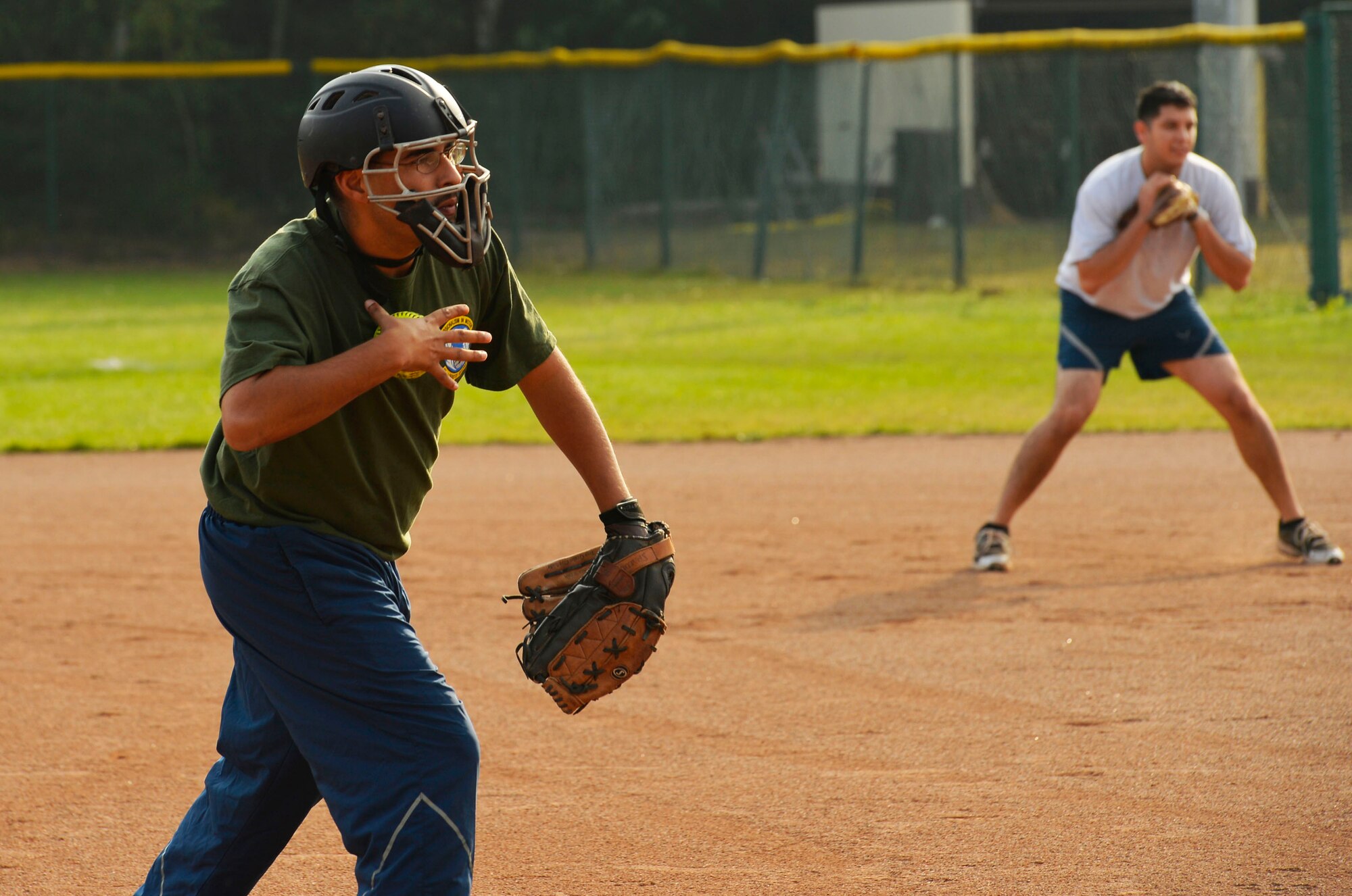 Senior Airman Robert Duran, 86th Logistics Readiness Squadron fuels controller, pitches during a softball game at Ramstein Air Base, Germany, Sept. 23, 2016. The game was part of the Commander’s Challenge, where 86th Airlift Wing Airmen participated in 15 different sporting events throughout the day. In addition to softball, the Commander’s Challenge included basketball, golf, soccer, volleyball, and flag football among others. (U.S. Air Force photo by Airman 1st Class Joshua Magbanua)