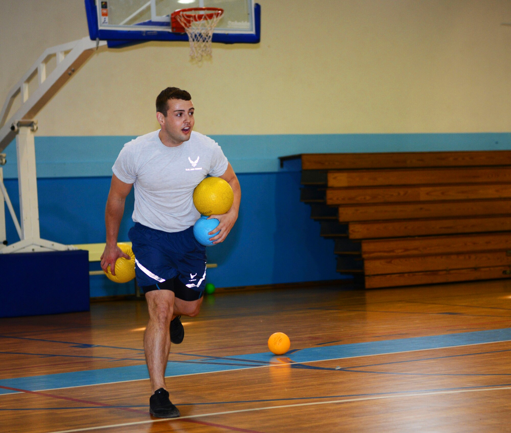 Senior Airman Anthony Oldham, 37th Airlift Squadron loadmaster, plays dodgeball during the 2016 Commander’s Challenge at Ramstein Air Base, Germany, Sept. 23, 2016. Oldham was the remaining person on his team after the rest of his teammates were out. In addition to dodgeball, the Commander’s Challenge also included flag football, softball, kickball, soccer, and a Humvee push among other sporting events. (U.S. Air Force photo by Airman 1st Class Joshua Magbanua)