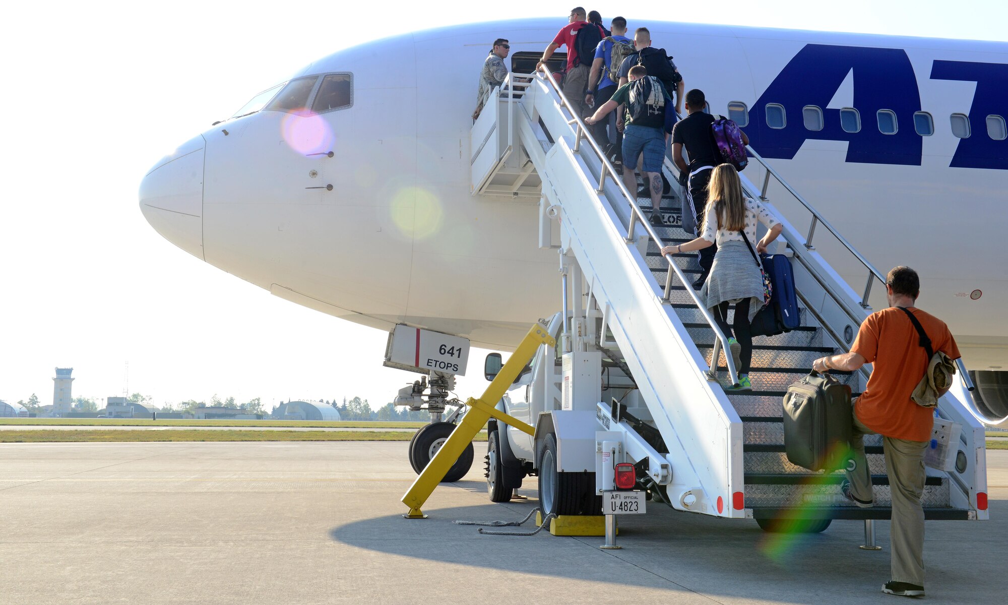 Travelers board the Patriot Express rotator at Aviano Air Base, Italy on Sept. 28, 2016. Beginning Oct. 1, 2016, the Patriot Express rotator mission will no longer be available into and out of Aviano AB. (U.S. Air Force photo by Tech. Sgt. R.J. Biermann/Released)