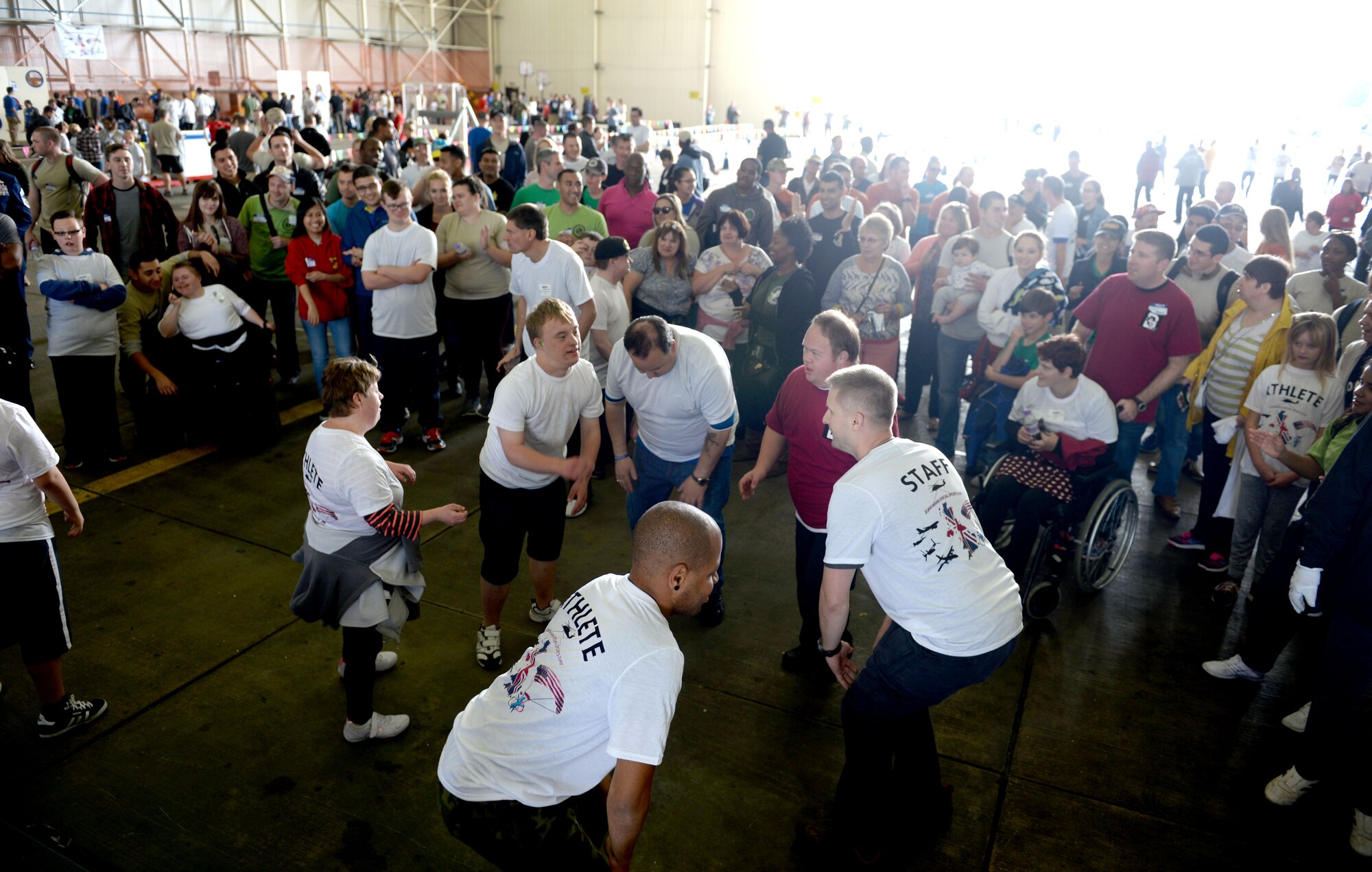 Athletes at the 35th Annual Joan Mann Special Sports Day participate in a dance-off before the medal presentations Sept. 24, 2016, on RAF Mildenhall, England. More than 500 volunteers, Airmen and dependents from RAF Mildenhall, RAF Lakenheath and RAF Feltwell made this event possible for more than 200 athletes. (U.S. Air Force photo by Staff Sgt. Kate Thornton)