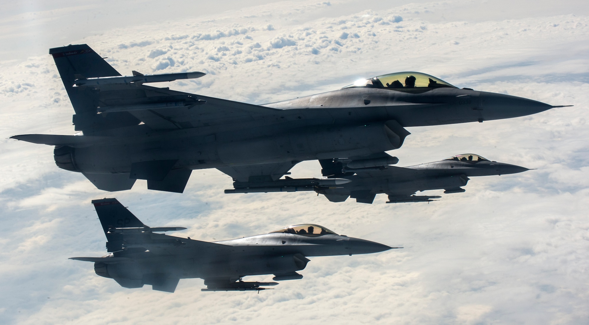 U.S. Air Force F-16 Fighting Falcons fly beside a KC-135 Stratotanker from the 191st Air Refueling Squadron, Roland R. Wright Air National Guard Base, Utah, after receiving fuel during a refueling mission over Ramstein Air Base, Germany, Sept. 26, 2016. The Stratotanker helps Spangdahlem’s F-16s train in air-to-air refueling for a longer duration and with more aircraft. (U.S. Air Force photo/Airman 1st Class Preston Cherry)