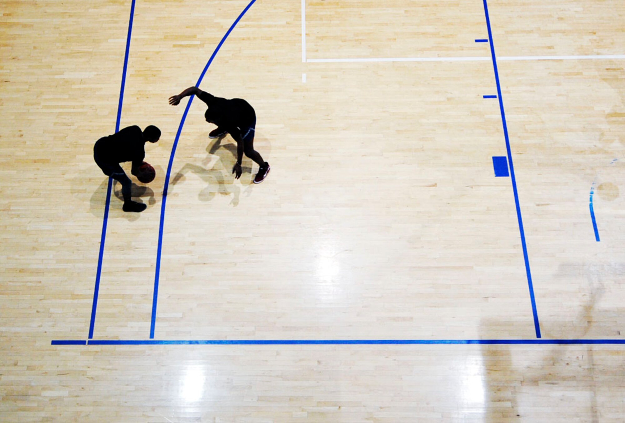 Airmen compete in a basketball tournament during the Commander’s Challenge Sept. 23, 2016, at Ramstein Air Base, Germany. The Commander’s Challenge emphasized aspects of the Comprehensive Airman Fitness program through various sporting events. The 86th Logistics Readiness Squadron took first place in the basketball tournament. (U.S. Air Force photo by Staff Sgt. Sharida Jackson)