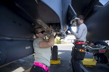 U.S. Air Force Airman 1st Class Savannah Chiles (left) and Airman 1st Class Andrew Smith, 48th Aircraft Maintenance Squadron aircraft armament system technicians, remove impulse cartridges after a sortie in support of Tactical Leadership Programme 16-3 at Los Llanos Air Base, Spain Sept. 19. Throughout its 39-year history, TLP has become the focal point for NATO’s Allied Air Forces tactical training, developing the knowledge and leadership skills necessary to face today's tactical challenges in the air. (U.S. Air Force photo/ Staff Sgt. Emerson Nuñez)