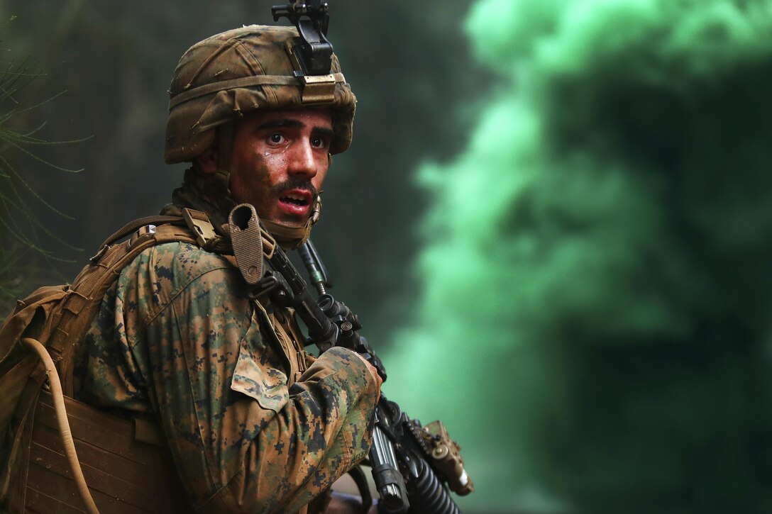 Marine Corps Lance Cpl. Daniel Wagenblast stands ready for  a casualty evacuation exercise during the advanced infantry course at Kahuku Training Area, Hawaii, Sept. 20, 2016. Wagenblast is a rifleman assigned to Bravo Company, 1st Battalion, 3rd Marine Regiment. Marine Corps photo by Cpl. Aaron S. Patterson