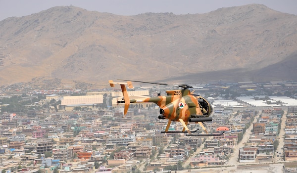 American advisors from Train, Advise, Assist Command-Air (TAAC-Air) flew a three ship MD-530 Cayuse Warrior training mission Aug. 25, 2016. The group left Hamid Karzai International Airport, Afghanistan, and flew over Kabul to a training range. After firing rockets and machine guns, the group flew back to HKIA. (U.S. Air Force photo by Capt. Jason Smith)