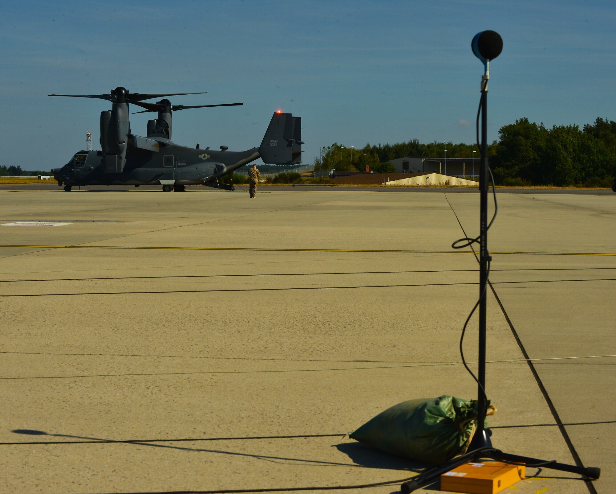 A U.S. Air Force CV-22 Osprey aircraft, assigned to the 352nd Special Operations Wing, Royal Air Force Mildenhall, England, undergoes acoustic testing on the flightline at Spangdahlem Air Base, Germany, Sept. 21, 2016. During the test, a local acoustic testing team placed multiple microphones around the CV-22 as part of the acoustic-testing process.  (U.S. Air Force photo by 1st Lt. Meredith Mulvihill)  