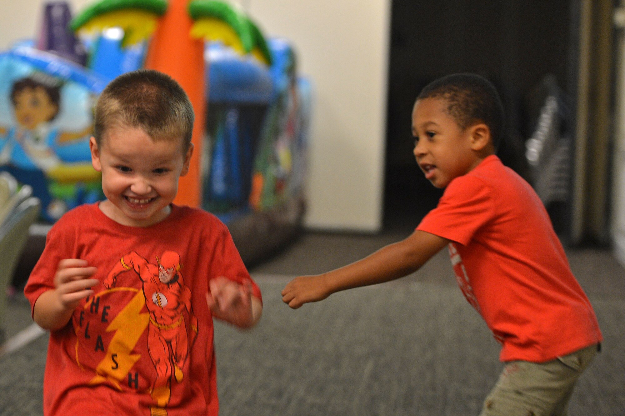 Team Shaw children play during a deployed family dinner at the Carolina Skies Club and Conference Center at Shaw Air Force Base, S.C., Sept. 26, 2016. The event provided bounce houses and obstacle courses to entertain the children. (U.S. Air Force photo by Airman 1st Class Christopher Maldonado)
