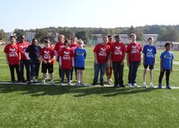 Children from Kaiserslautern and Ramstein Middle Schools pose for a photo before an adaptive sports soccer game at Kaiserslautern High School on Vogelweh Military Complex, Germany, Sept. 22, 2016. Adaptive sports provides children with disabilities the opportunity to socialize and have fun with their peers. (U.S. Air Force photo by Jimmie D. Pike)
