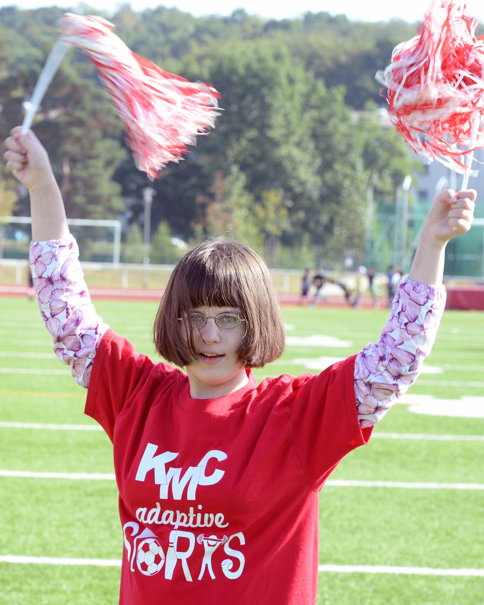 Erin Fairchild, a Kaiserslautern Middle School student, cheers for her school’s team during an adaptive sports soccer game at Vogelweh Military Complex, Germany, Sept. 22, 2016. While partaking in the adaptive sports program children can stay fit and work on social skills in a fun environment. (U.S. Air Force photo by Senior Airman Jimmie D. Pike)