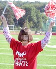 Erin Fairchild, a Kaiserslautern Middle School student, cheers for her school’s team during an adaptive sports soccer game at Vogelweh Military Complex, Germany, Sept. 22, 2016. While partaking in the adaptive sports program children can stay fit and work on social skills in a fun environment. (U.S. Air Force photo by Senior Airman Jimmie D. Pike)