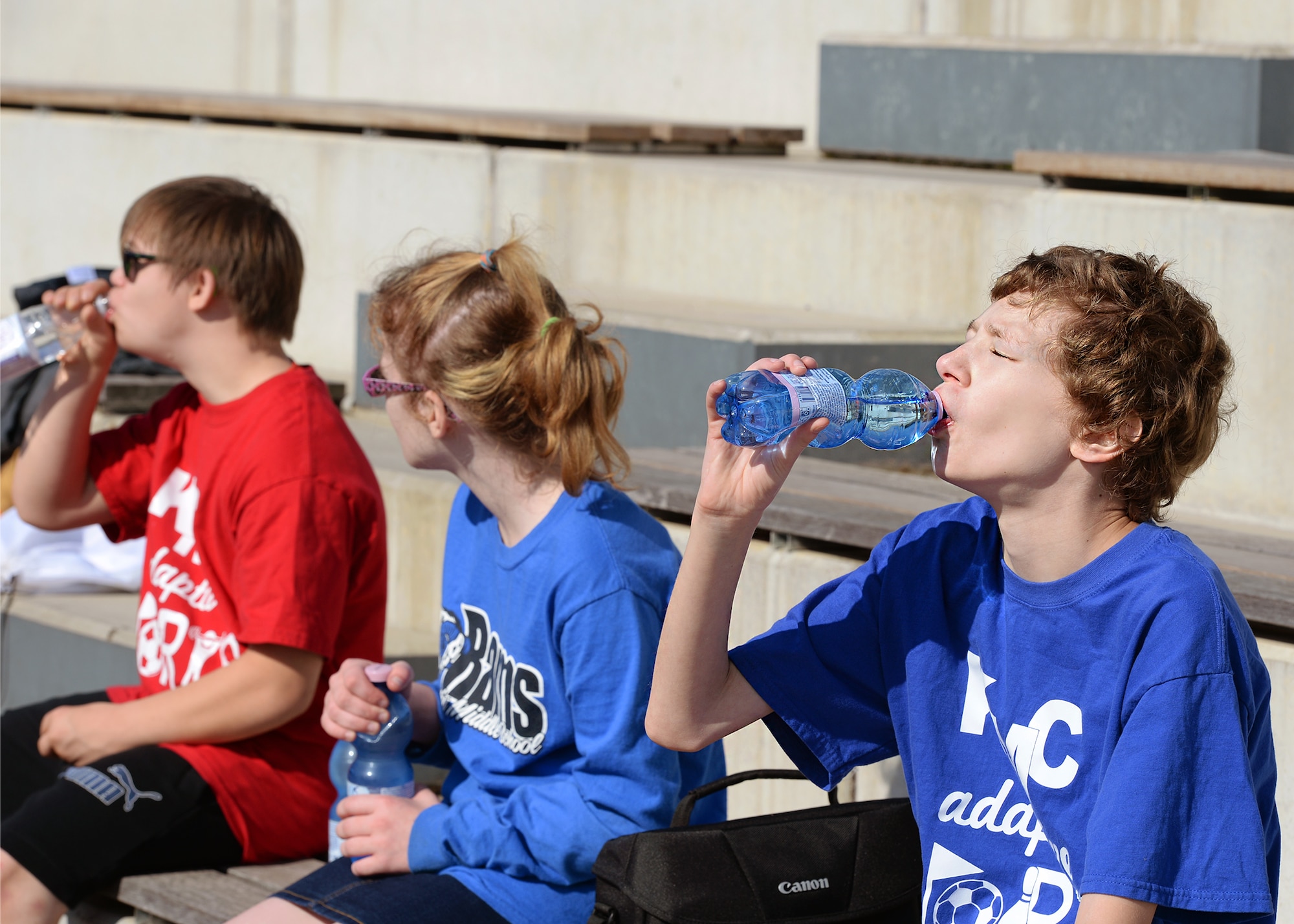 Students rehydrate during a break from an adaptive sports soccer game at Vogelweh Military Complex, Germany, Sept. 22, 2016. The adaptive sports program provides children with disabilities an opportunity to live an active and healthy lifestyle. (U.S. Air Force photo by Senior Airman Jimmie D. Pike) 