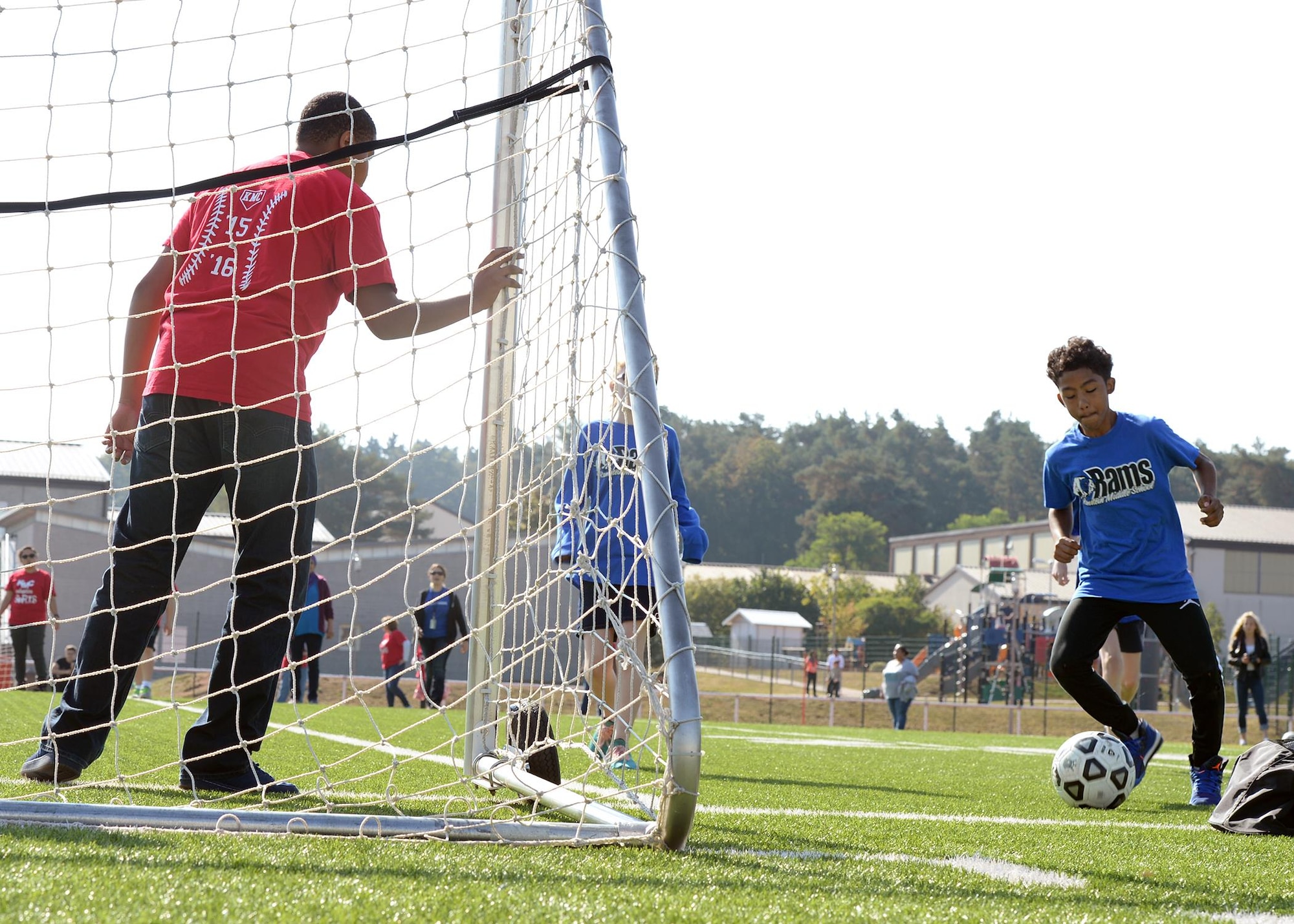 Elijah Muhammad, a Ramstein Middle School student, prepares to take a shot on goal during an adaptive sports soccer game at Vogelweh Military Complex, Germany, Sept. 22, 2016. Participating students from Ramstein and Kaiserslautern Middle Schools played two games of soccer before breaking for lunch. (U.S. Air Force photo by Senior Airman Jimmie D. Pike)