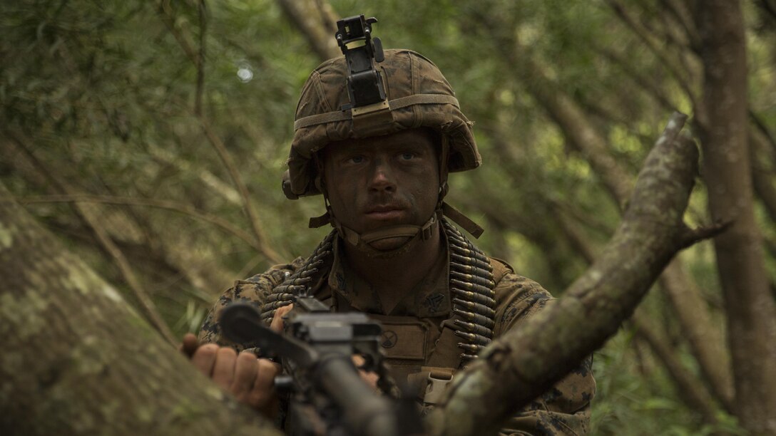 Cpl. Zachary Thomas, a rifleman with Charlie Company, 1st Battalion, 7th Marine Regiment, and a Palatka, Florida, native, provides security with his M240 Machine Gun during a patrol as part of a training exercise aboard the Kahuku Training Facility, Sept. 20, 2016. The exercise is part of a 7-week-long training event known as the Advance Infantry Course. The Advance Infantry Course, which is conducted by the Advance Infantry Battalion, Detachment Hawaii, is an advanced 0311 rifleman Military Occupational Specialty course for squad leaders who are currently serving in the operating field. 