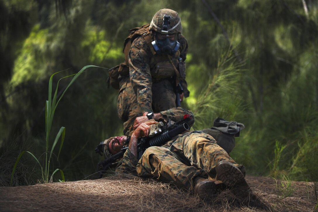 Marine Corps Lance Cpl. Anthony Acedo plays a simulated casualty during the advanced infantry course at Kahuku Training Area, Hawaii, Sept. 21, 2016.  Acedo is a rifleman assigned to 1st Battalion, 7th Marine Regiment. Marine Corps photo by Cpl. Aaron S. Patterson