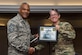 U.S. Army Master Sgt. Melissa White, F Company, 1-222nd Aviation Regiment first sergeant, presents U.S. Air Force Chief Master Sgt. Jack Johnson Jr., NATO command senior enlisted leader, with a certificate of appreciation during a diamond council meeting at Joint Base Langley-Eustis, Va., Sept. 23, 2016. The Fort Eustis diamond council consists of first sergeants who support the JBLE community through morale, welfare and recreation events. (U.S. Air Force photo by Airman 1st Class Derek Seifert)