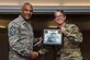 U.S. Army Master Sgt. Melissa White, F Company, 1-222nd Aviation Regiment first sergeant, presents U.S. Air Force Chief Master Sgt. Jack Johnson Jr., NATO command senior enlisted leader, with a certificate of appreciation during a diamond council meeting at Joint Base Langley-Eustis, Va., Sept. 23, 2016. The Fort Eustis diamond council consists of first sergeants who support the JBLE community through morale, welfare and recreation events. (U.S. Air Force photo by Airman 1st Class Derek Seifert)