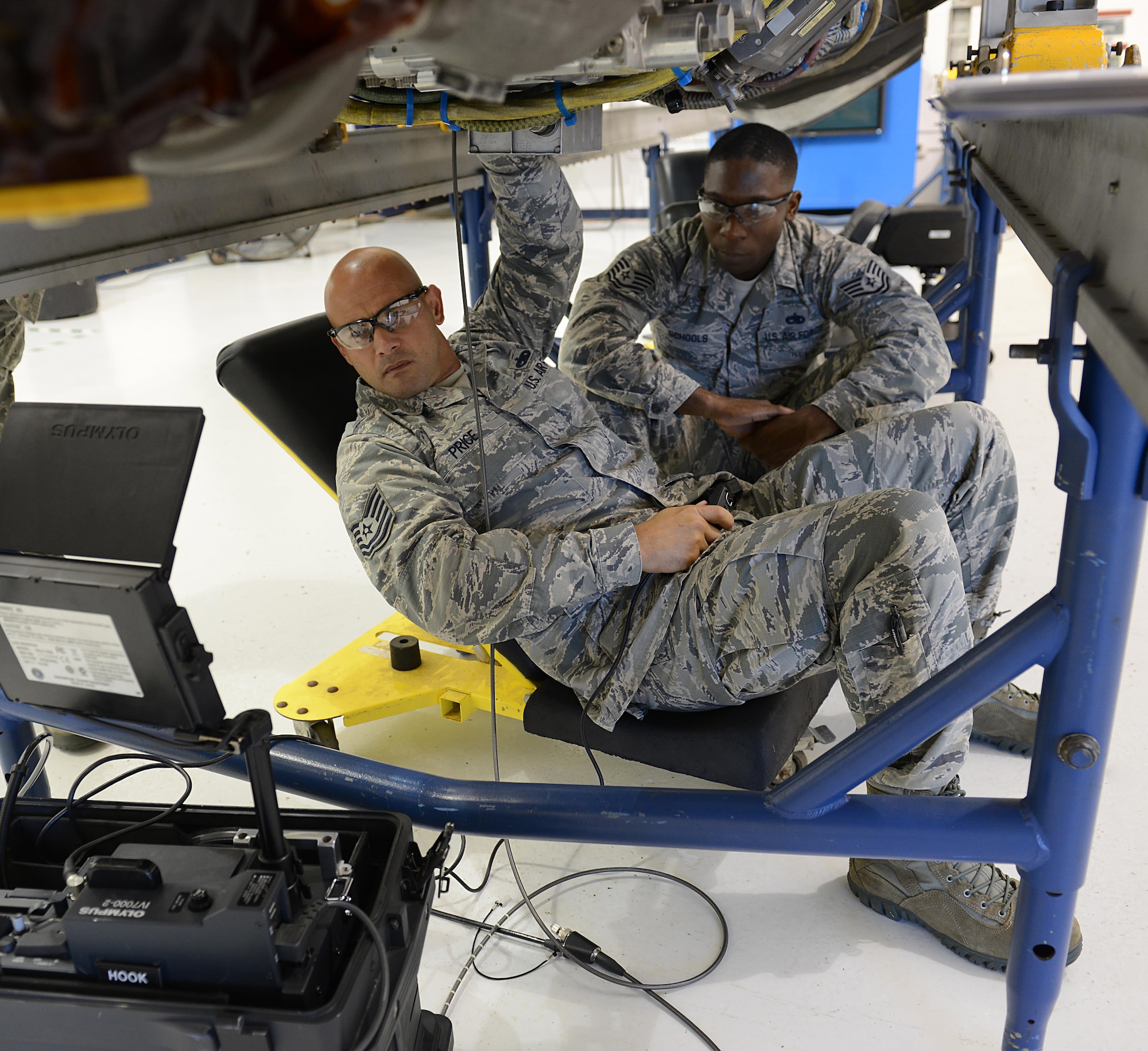 U.S. Air Force Tech. Sgt. Brian Price, 1st Maintenance Group maintenance training instructor, demonstrates the proper use of a flexible borescope to U.S. Air Force Tech. Sgt. Riyyad Schools, 1st Maintenance Squadron jet engine intermediate maintenance NCO in charge, during a class at Joint Base Langley-Eustis, Va., Sept. 12, 2016. The 1st Maintenance Group training section is responsible for the combat training of all maintenance personnel assigned to the 1st MXG, as well as some sections of the 192nd Maintenance Group. (U.S. Air Force photo by Staff Sgt. Teresa J. Cleveland)