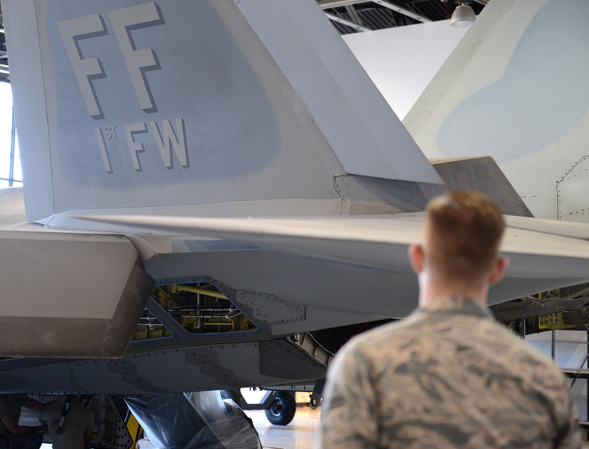 A U.S. Air Force Airman observes a hot pit refueling procedure on an F-22A Raptor training aircraft during training class at Joint Base Langley-Eustis, Va., Sept. 13, 2016. The class, led by trainers from the 1st Maintenance Group training section, teaches maintainers the proper procedures to work with logistics Airmen to refuel aircrafts while the engines are still running, allowing for quicker turnaround for jets to return to flight. (U.S. Air Force photo by Staff Sgt. Teresa J. Cleveland)