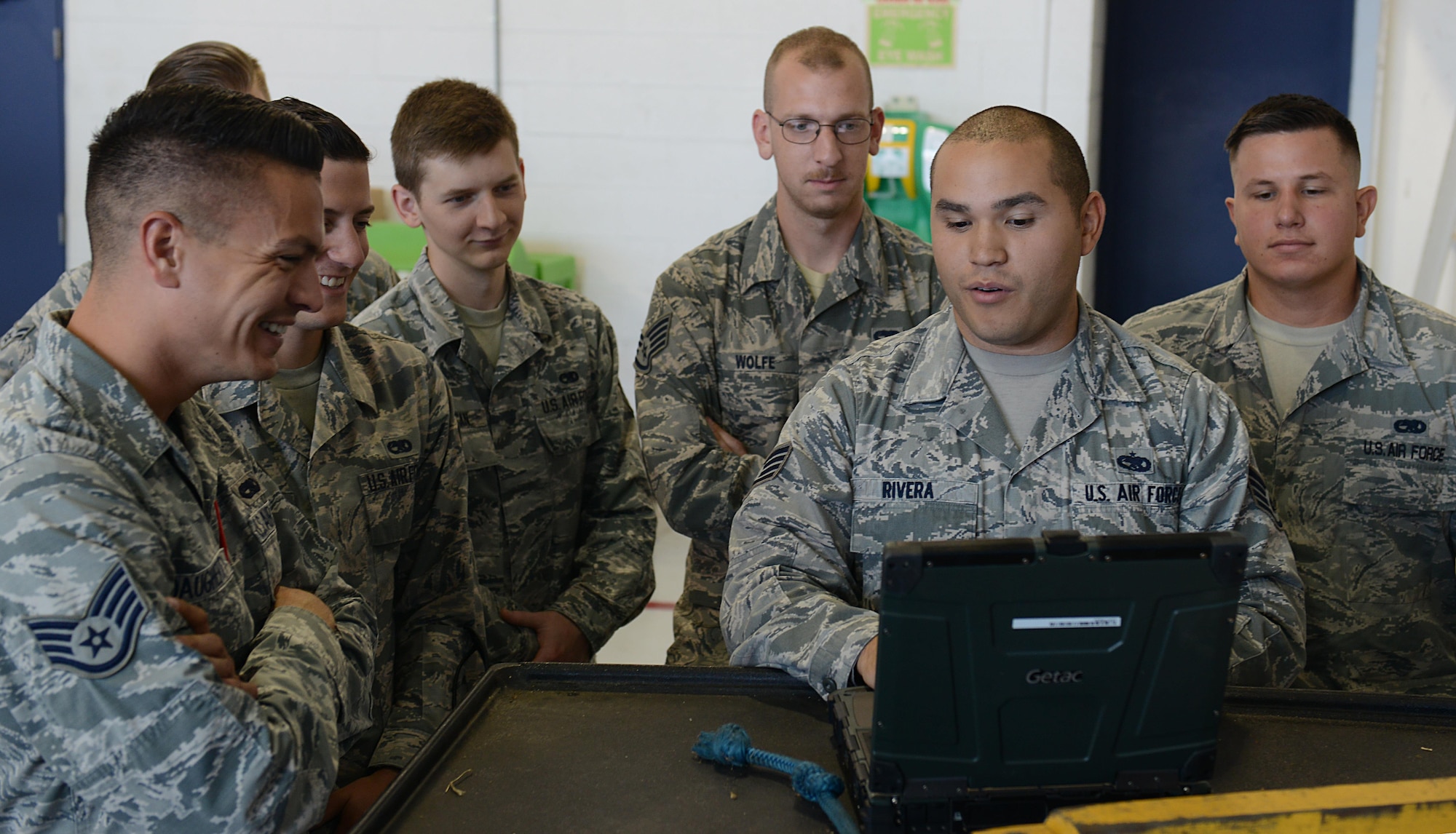 U.S. Air Force Staff Sgt. Daniel Rivera, 1st Maintenance Group maintenance training instructor, demonstrates steps Airmen must follow during a hot pit refueling class at Joint Base Langley-Eustis, Va., Sept. 13, 2016. Airmen with the 1st MXG attend between one and six courses through the training section each year, depending on their job requirements. (U.S. Air Force photo by Staff Sgt. Teresa J. Cleveland)