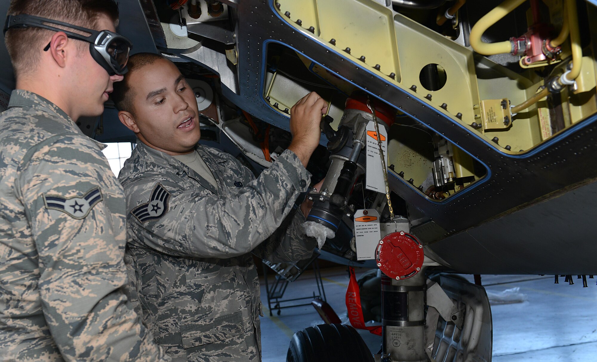 U.S. Air Force Staff Sgt. Daniel Rivera, 1st Maintenance Group maintenance training instructor, demonstrates the proper procedures for hot pit refueling for Airmen in a training class at Joint Base Langley-Eustis, Va., Sept. 13, 2016. The maintenance training section offers 26 courses, ranging from job specific to Air Force requirements such as Self Aid and Buddy Care. (U.S. Air Force photo by Staff Sgt. Teresa J. Cleveland)